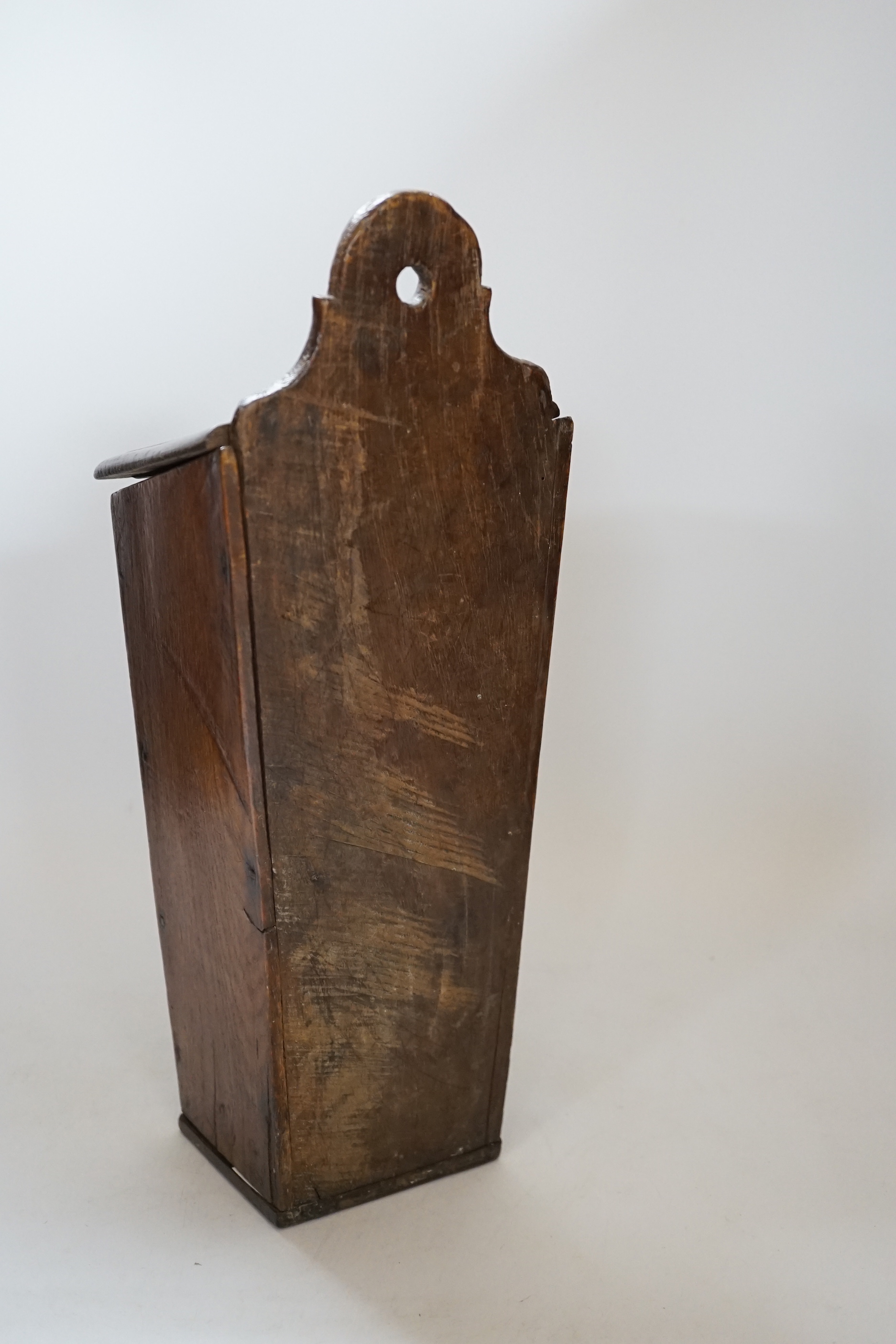 A 18th / 19th century oak candle box, 38cm high